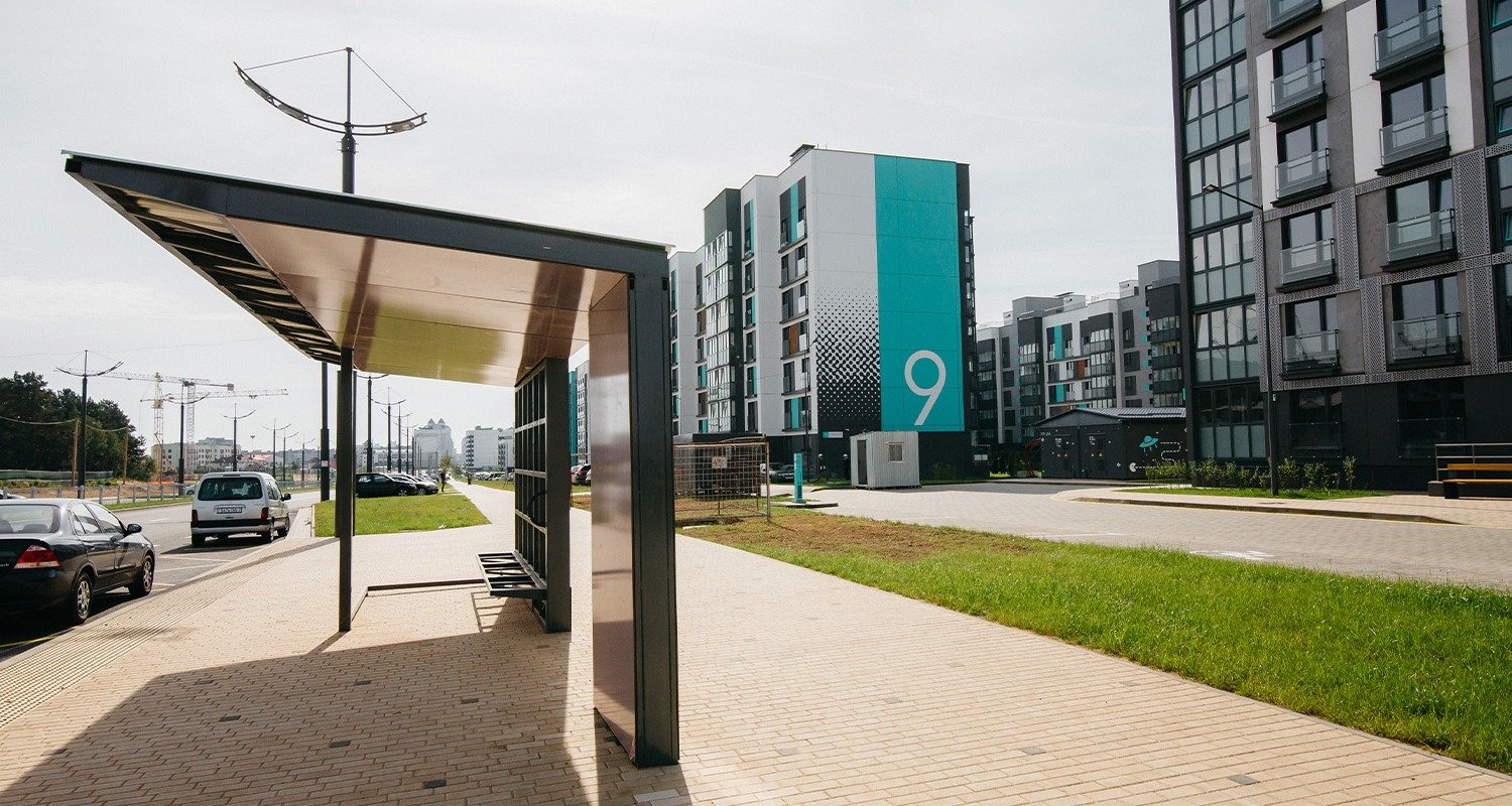 bus-stop-outside-large-living-complex bus-stop-outside-large-living-complex